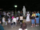 Praying and singing before Statue of Our Lady statue at Gospa Square