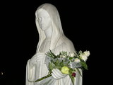 Statue of Our Lady with flowers
